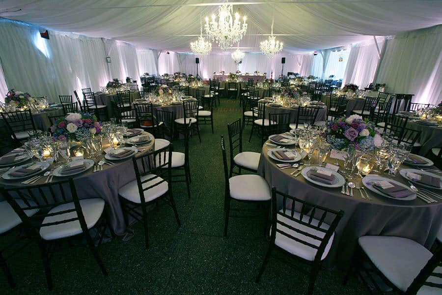 sailcloth tent interior with fancy lighting for outdoor wedding reception