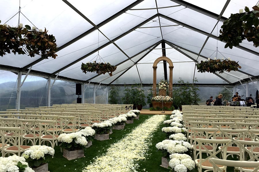 clear span tent for outdoor wedding ceremony during bad weather
