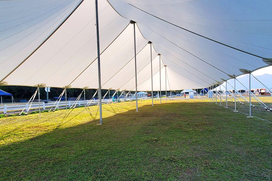 sailcloth tent over grass for outdoor event